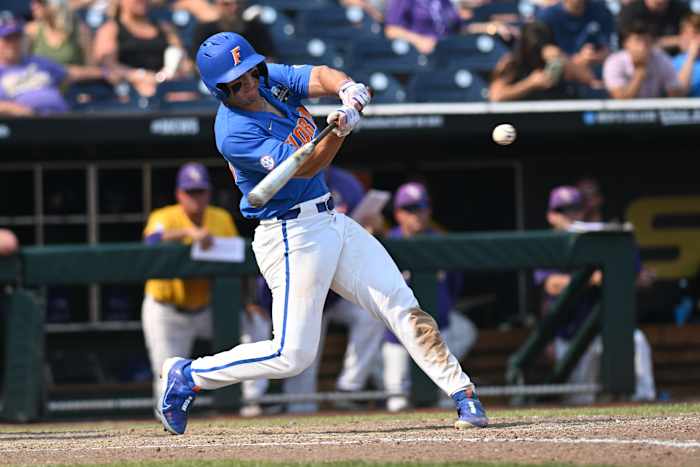 Jun 25, 2023; Omaha, NE, USA; Florida Gators center fielder Wyatt Langford (36) drives in a run with a double against the LSU Tigers in the eighth inning at Charles Schwab Field Omaha. Mandatory Credit: Steven Branscombe-USA TODAY Sports